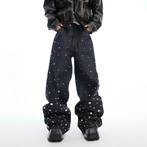 Front view of hand-stitched pearl raw denim jeans showing selvedge detail and unique pearl patchwork design