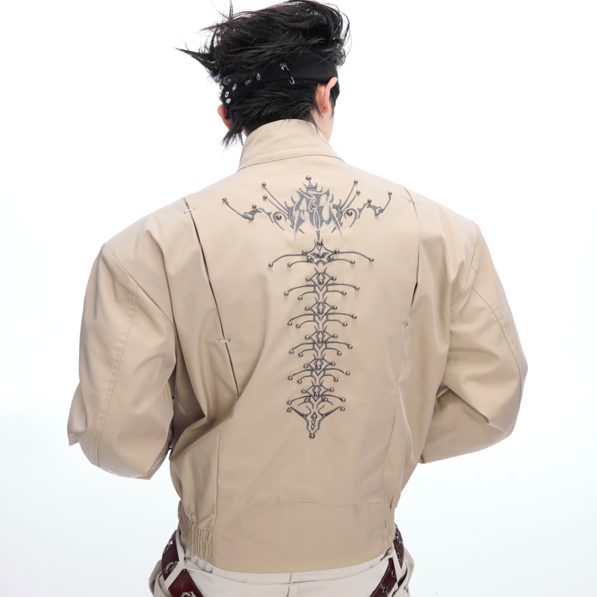 Close-up of 3D quilting details on the Snake-Eye Harrington jacket with innovative splicing design