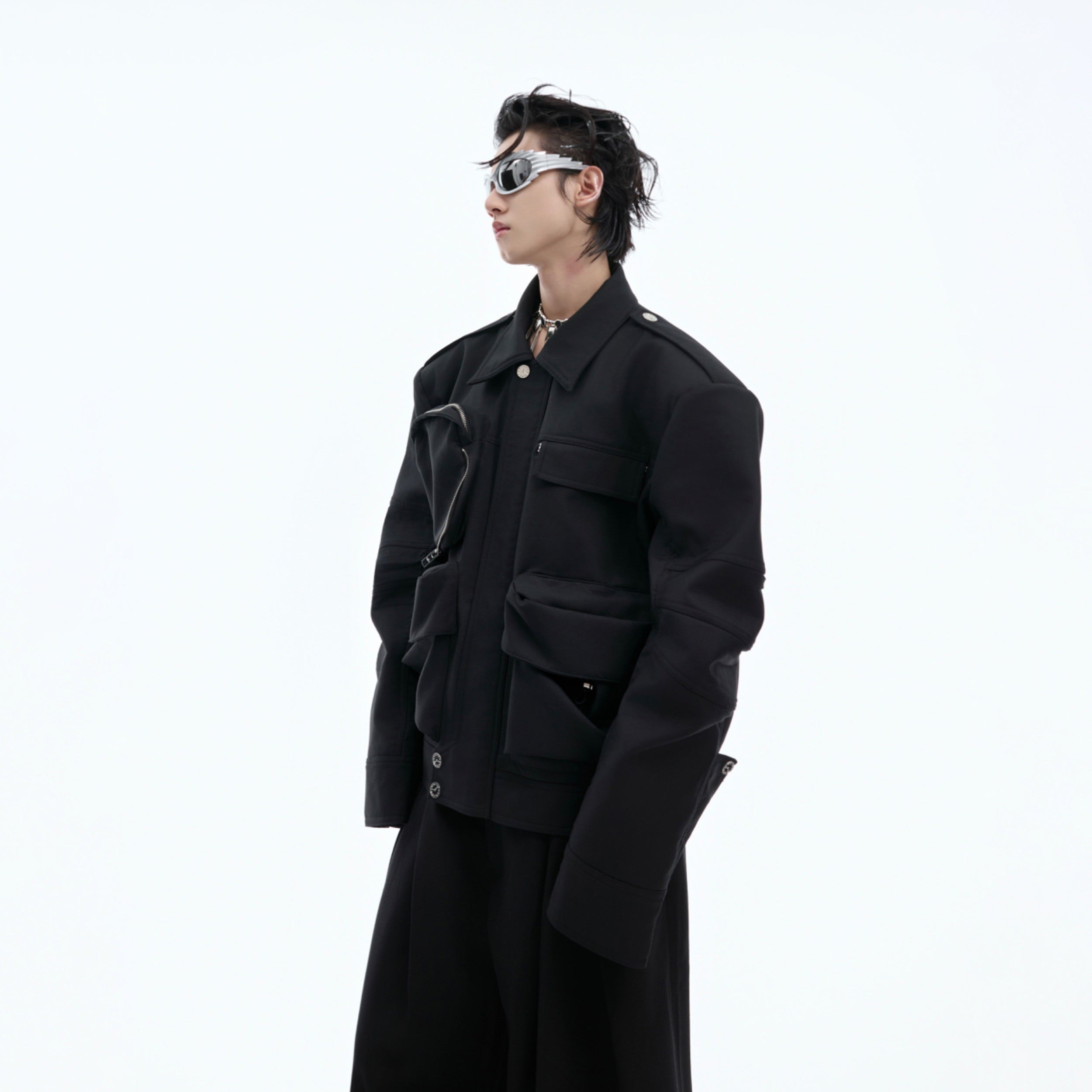 Close-up of the folded sleeves and raw edge detailing on this punk-inspired heavyweight streetwear jacket