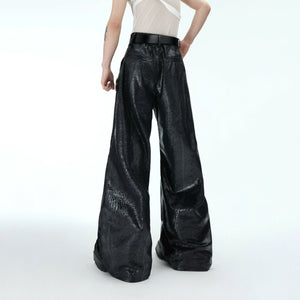 Front view of heavyweight straight-leg pants with metallic button accents, showcasing relaxed streetwear style and premium fabric
