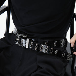 Flat lay view of complete distressed metal punk belt with measurements and studs