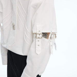 Side angle showing the hollow splicing design of this edgy white streetwear top
