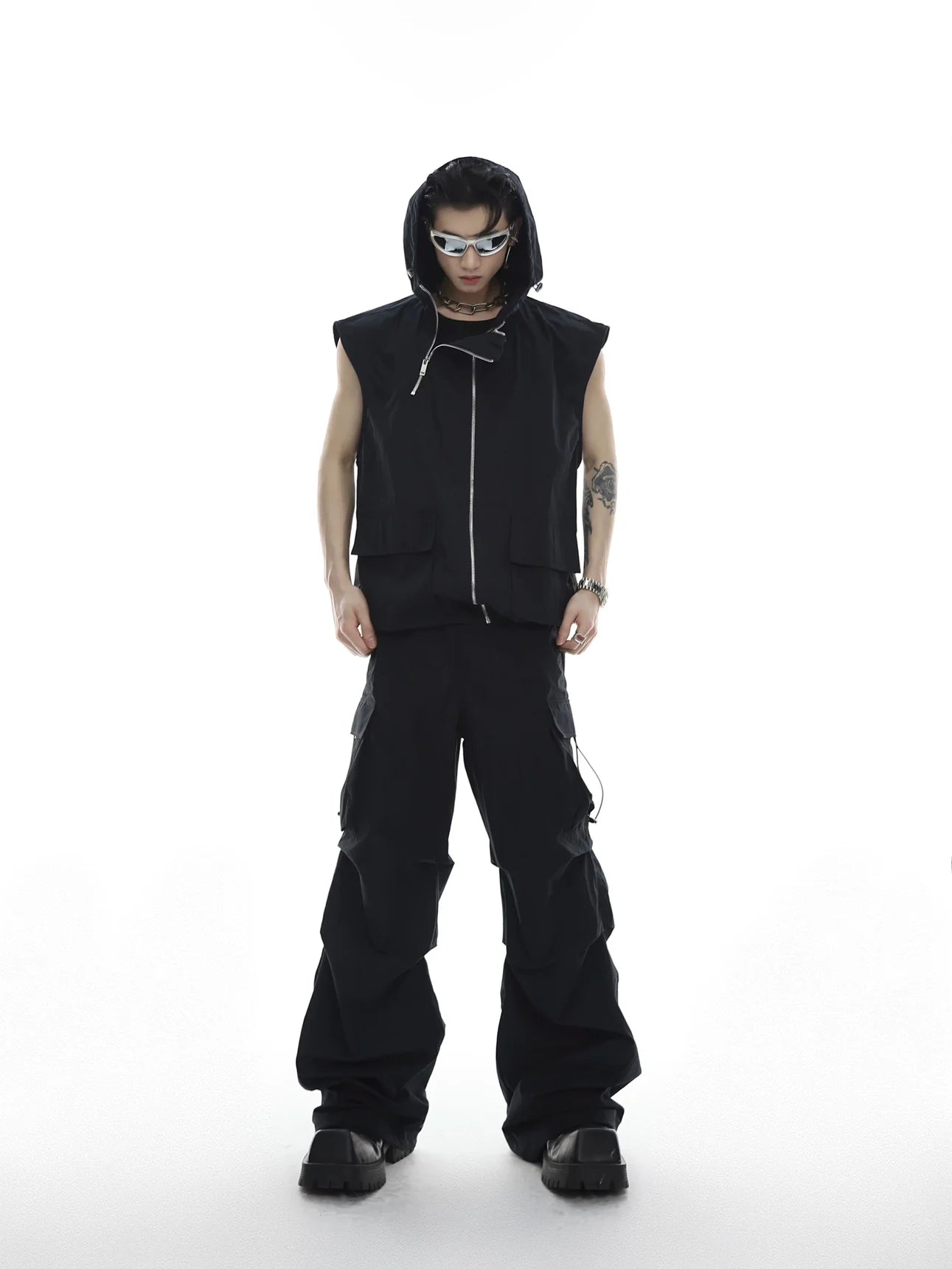 Deconstructed hooded vest jumpsuit set with distressed texture and asymmetrical zipper details for urban streetwear