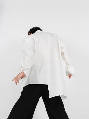 Side view showing the irregular layered construction of this premium cotton asymmetric shirt