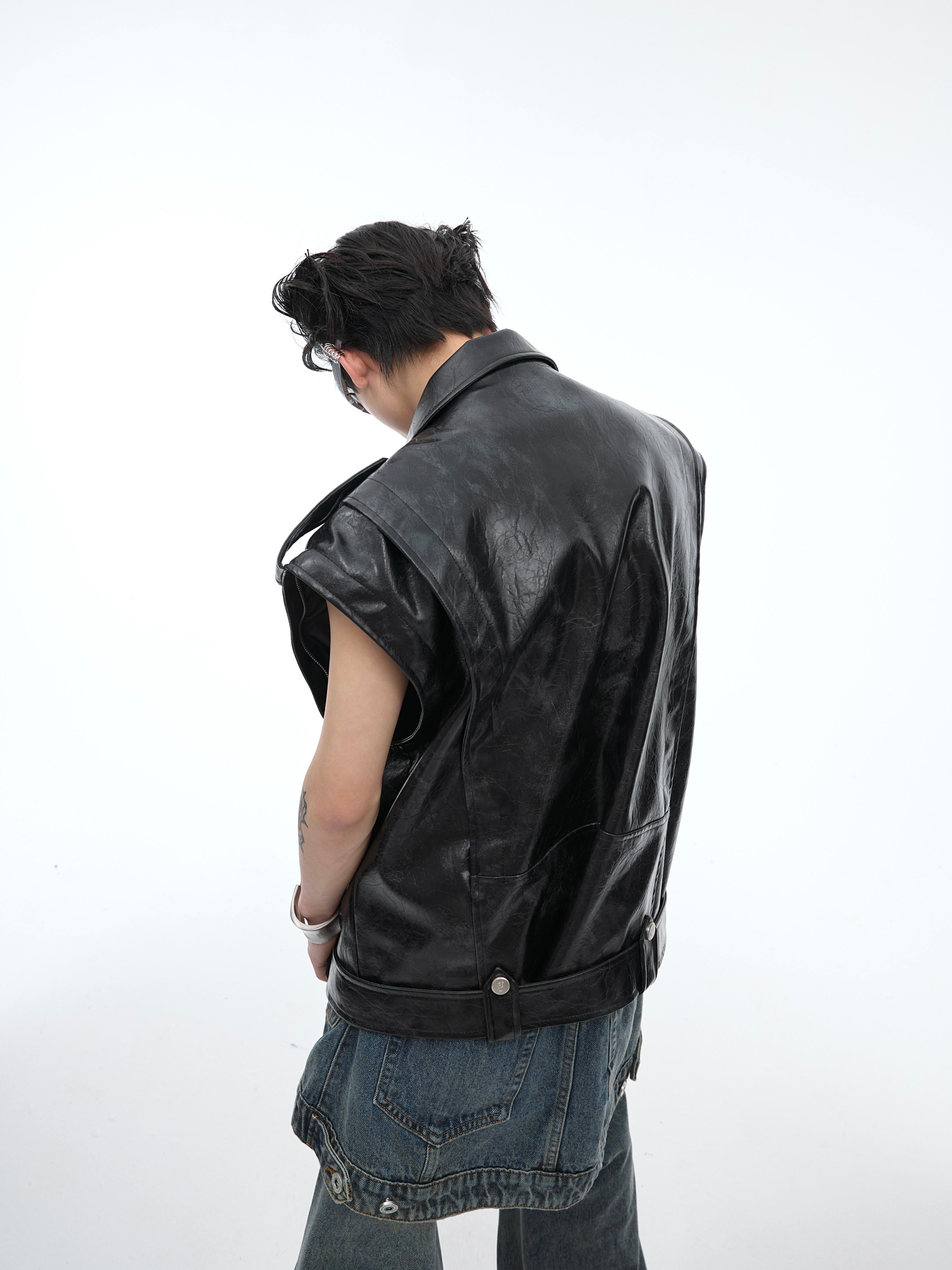 Front view of deconstructed waistcoat jacket featuring asymmetrical design and urban streetwear aesthetic