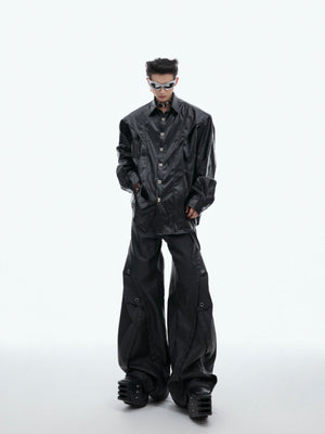 Close-up of signature hardware details on glossy liquid effect deconstructed long-sleeve shirt