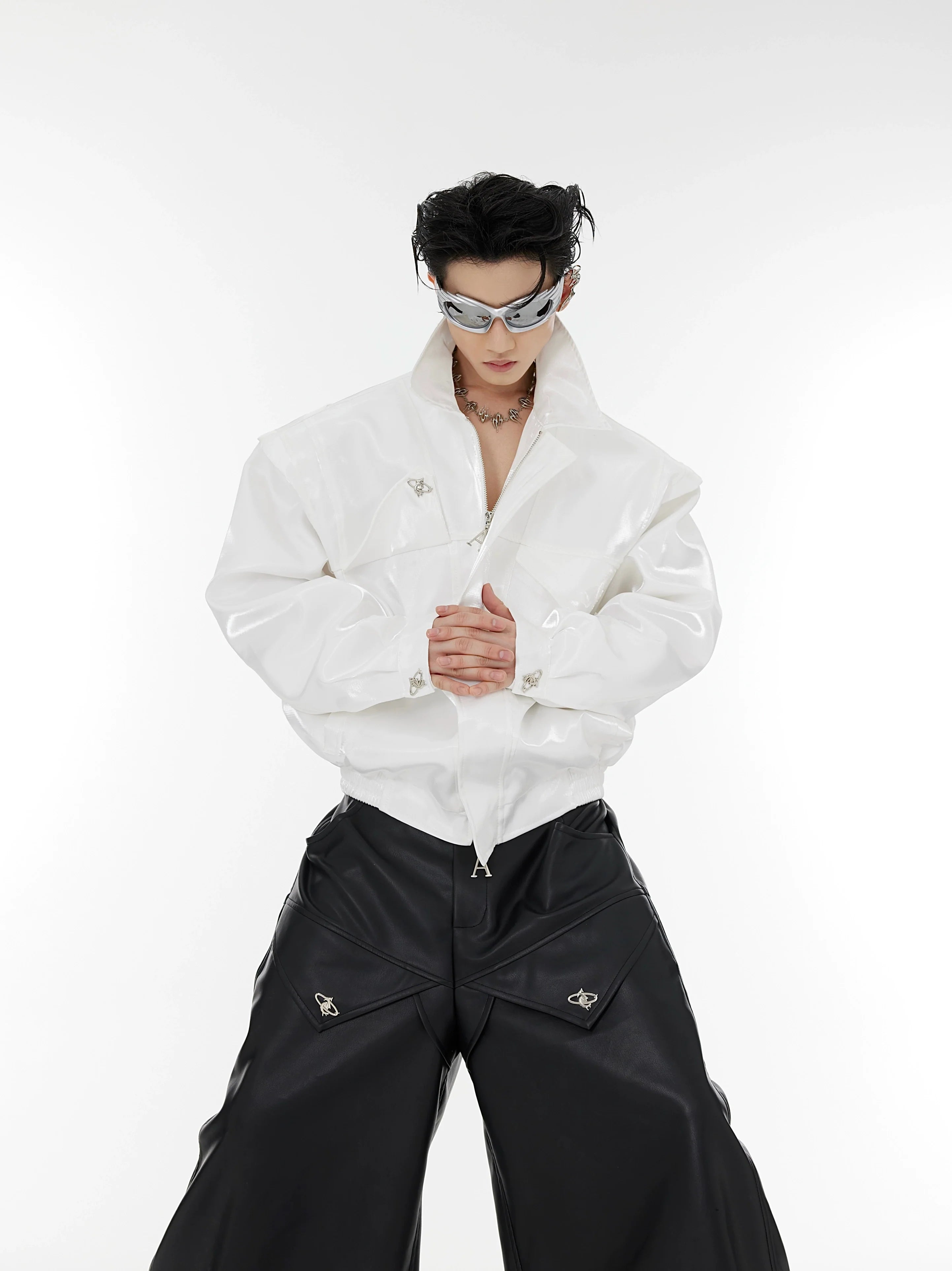 Avant-garde liquid shoulder cropped leather jacket with metallic accents and deconstructed design, perfect for streetwear fashion