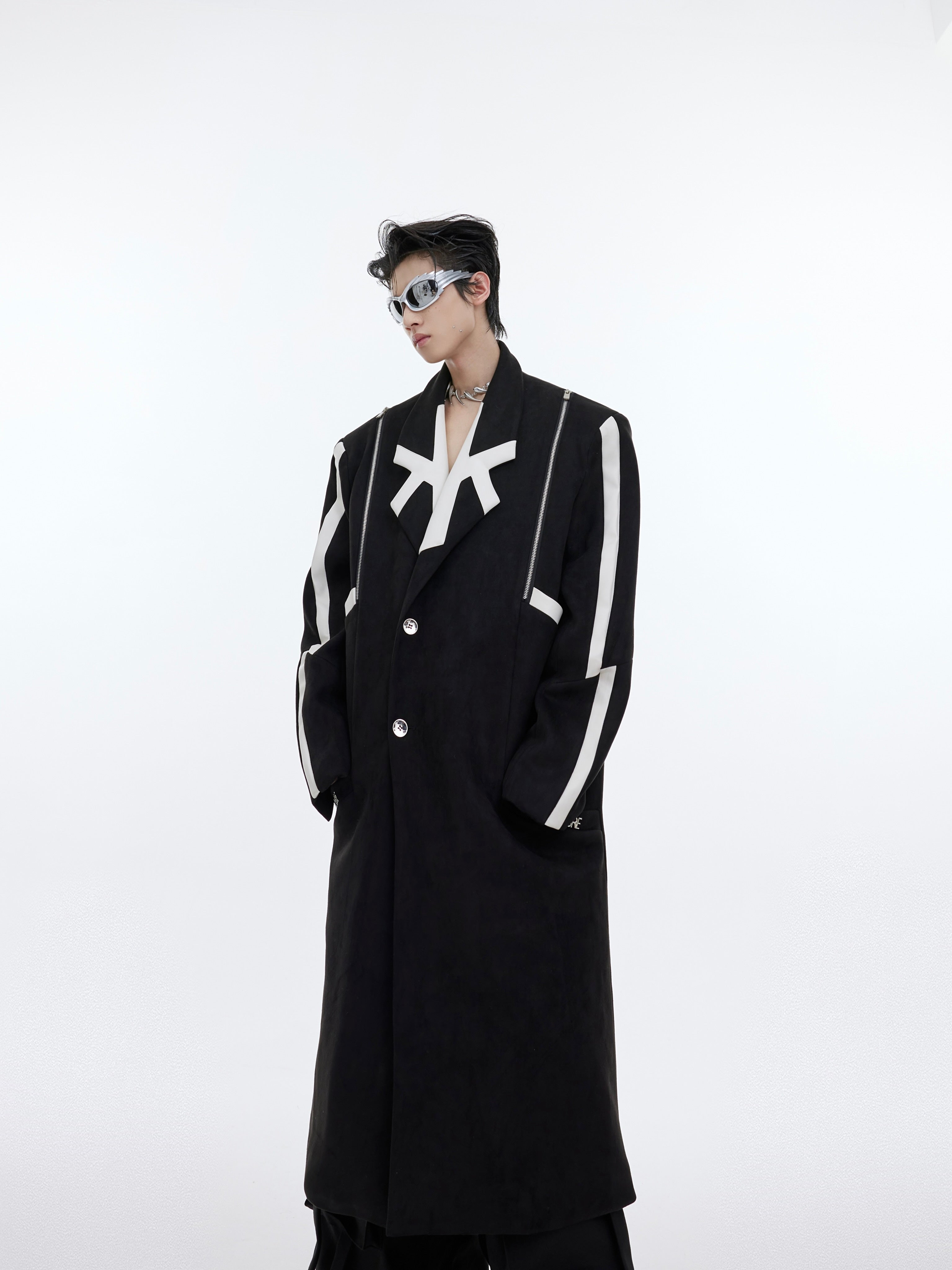 Statement striped long coat featuring an irregular hem design for edgy urban fashion looks