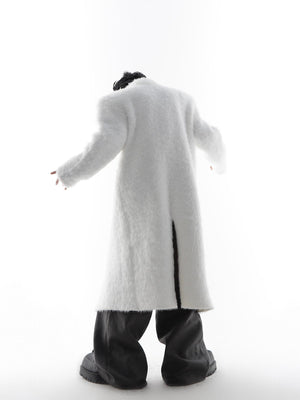 Side view of genderless oversized trench coat with dramatic silhouette and shoulder padding