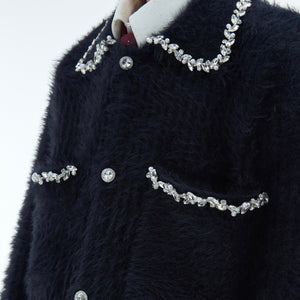 Fashionable layered look with this diamond-trimmed faux fur cardigan styled for street elegance