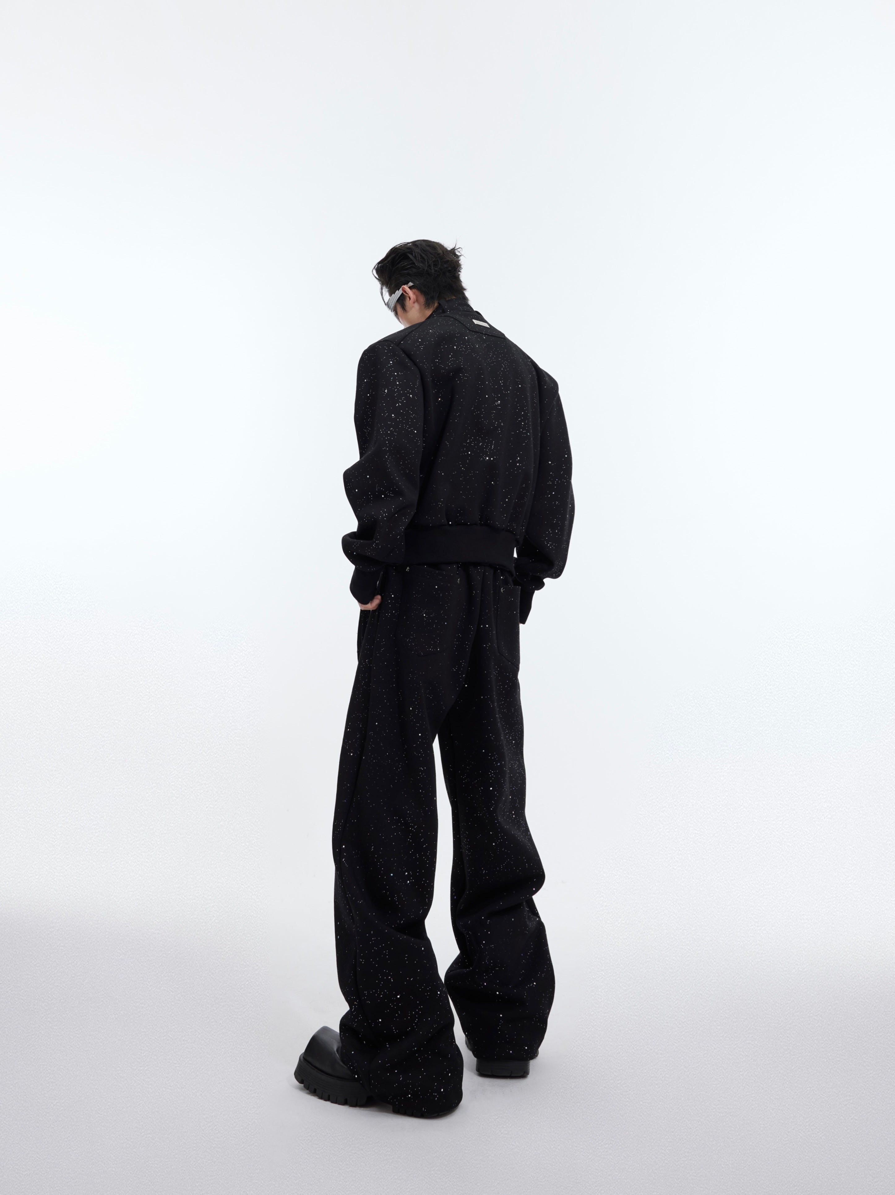 Side view of loose fit deconstructed sport suit for men, showing urban streetwear style with comfortable stretch fabric