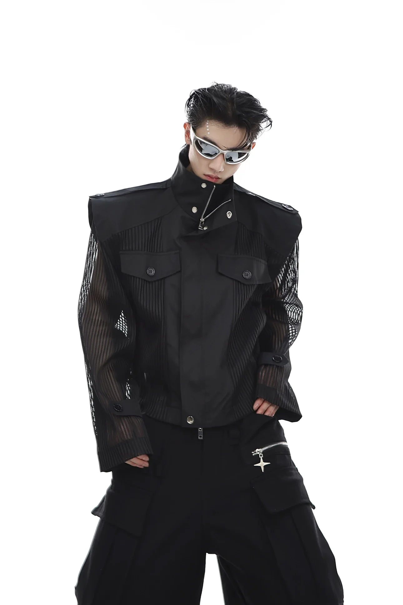 Front view of deconstructed mesh-paneled streetwear jacket with UV protection, showing cropped silhouette and breathable panels