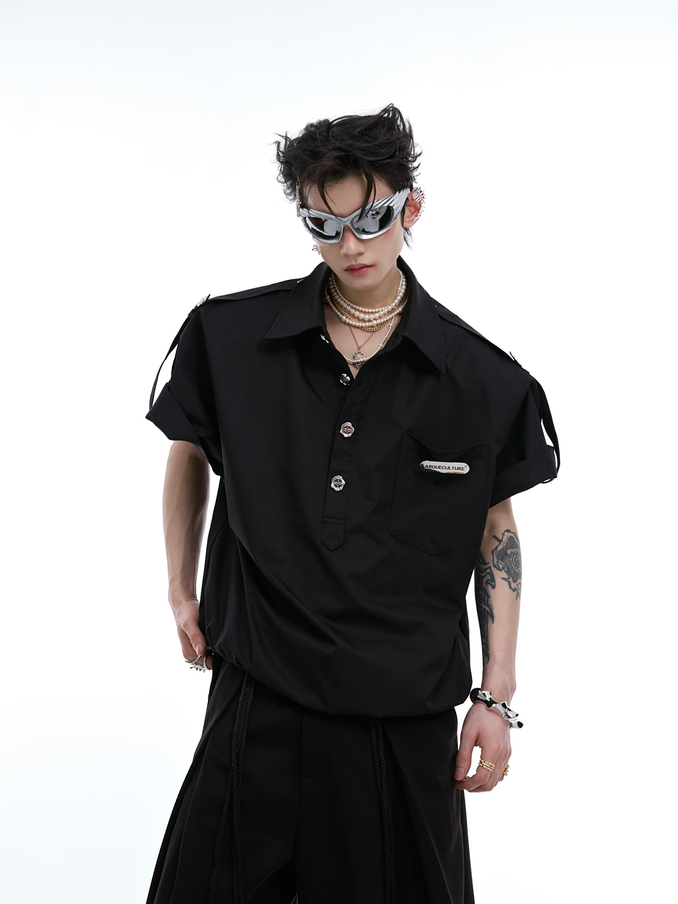 Streetwear metal-button polo shirt with structured shoulder detail, showing the deconstructed army collar design