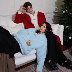 Close-up of the signature metal logo detailing on this luxury streetwear pullover