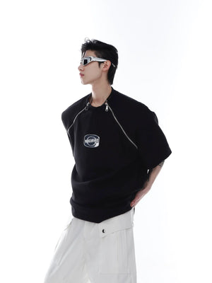 Front view of avant-garde white zip-up tee with metal trim detailing and structured shoulder pads for streetwear looks