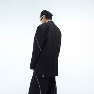 Side profile of structured yet relaxed fit metal-zipper blazer with urban streetwear aesthetic