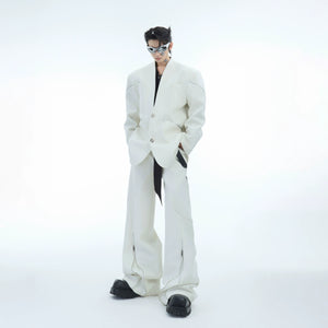 Front view of deconstructed blazer with metal zippers showing twill texture and low-cut neckline design