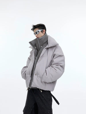 Front view of metallic-button puffer jacket with glossy two-tone design, perfect for urban streetwear fashion