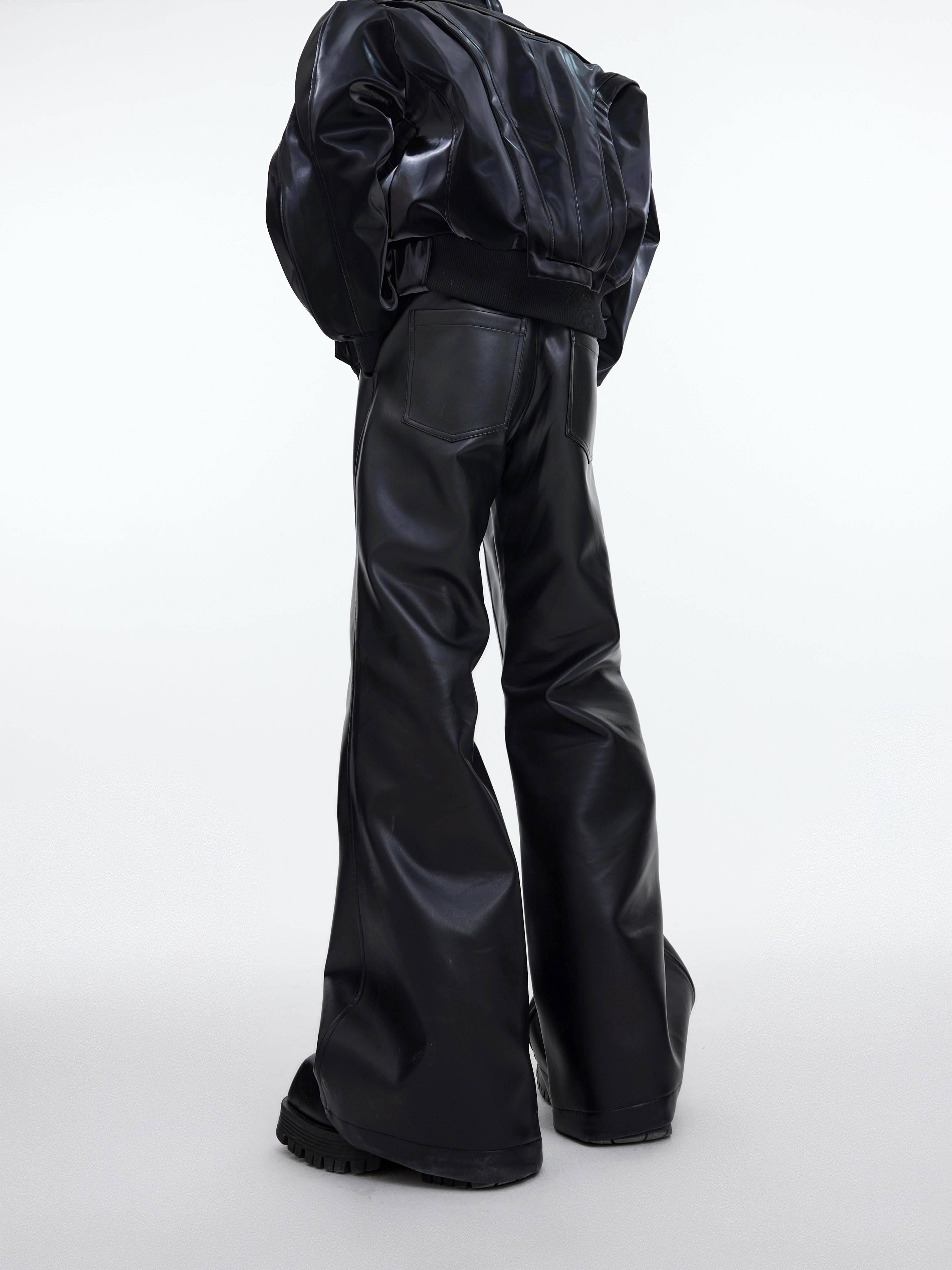 Side profile of micro flare leather pants highlighting the high-waist design and distressed detailing for urban fashion