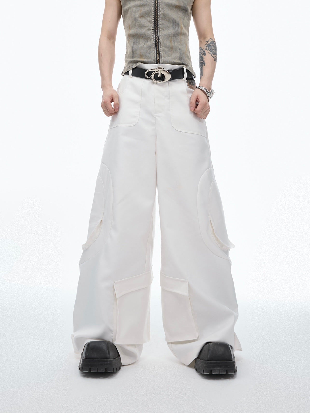 Front view of loose fit streetwear pants featuring unique ribbon-tie design and multiple pockets for urban style