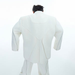 Styling example showing how to layer this deconstructed jacket with urban streetwear outfits