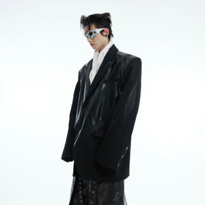 Front view of model wearing the deconstructed PU leather blazer with statement-making street style