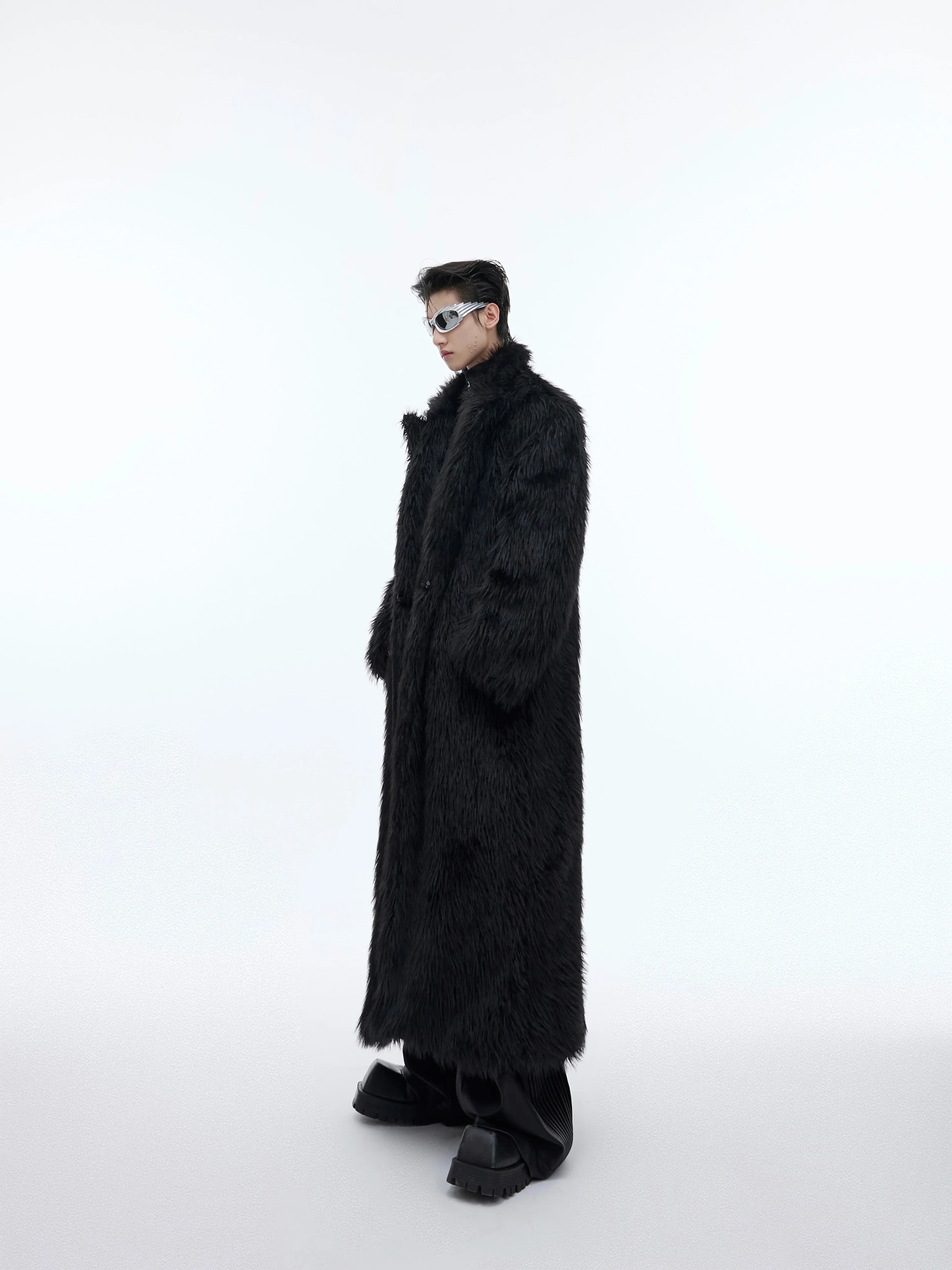 Oversized faux fur long coat in streetwear style, featuring a heavyweight puffer design with knee-length silhouette