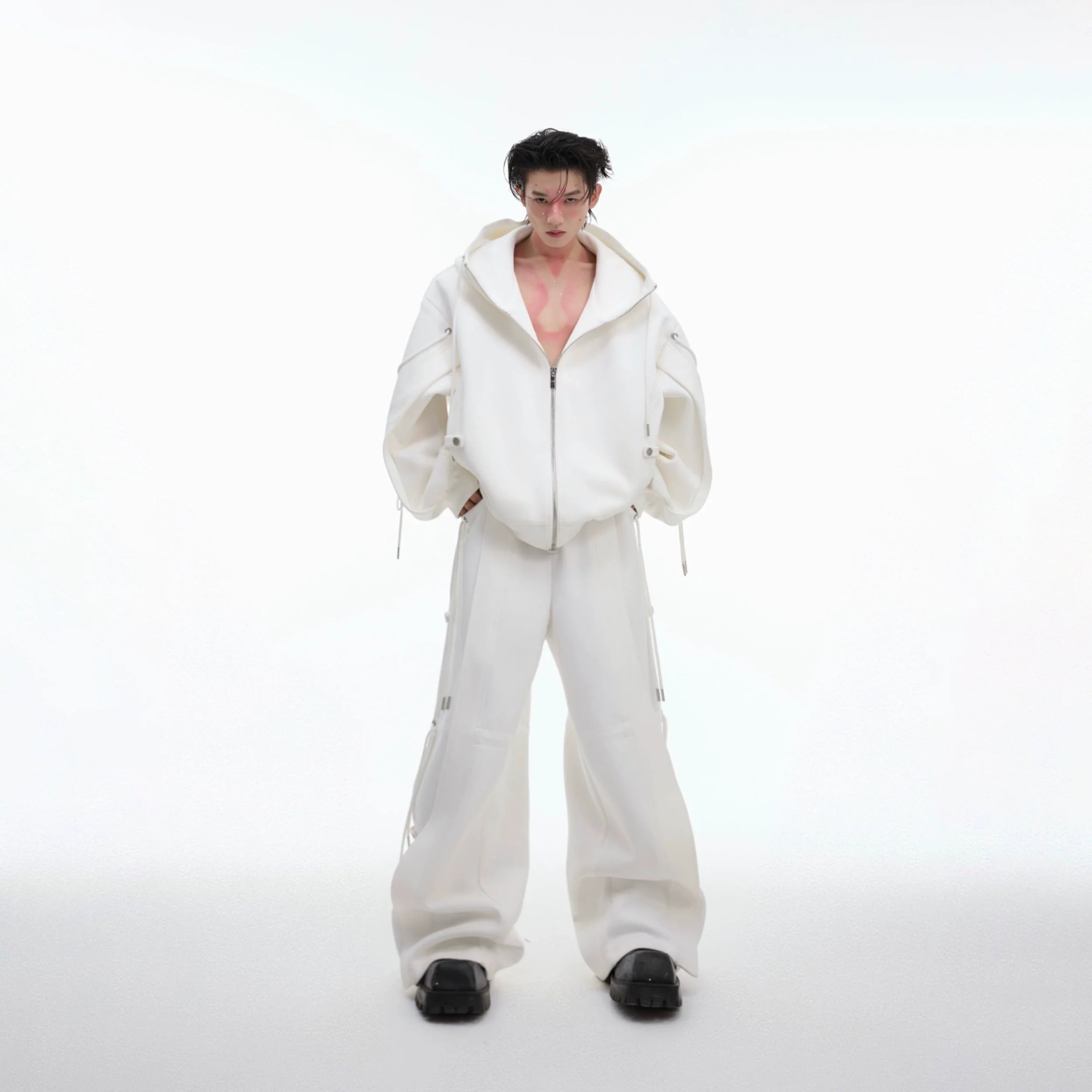 Front view of oversized hoodie with drawstrings in a stylish streetwear jogger set, featuring deconstruction design