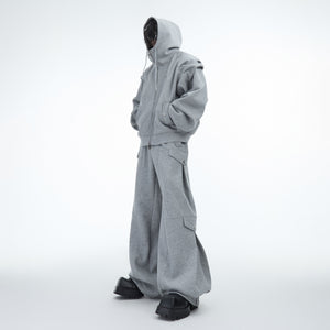 Front view of oversized hoodie with drop shoulder and pleat design, showcasing urban streetwear style