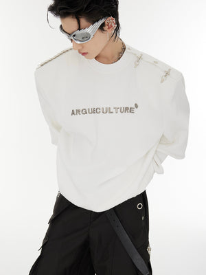 Street-style model wearing deconstructed bucket hoodie showcasing urban oversized fit and metal accents