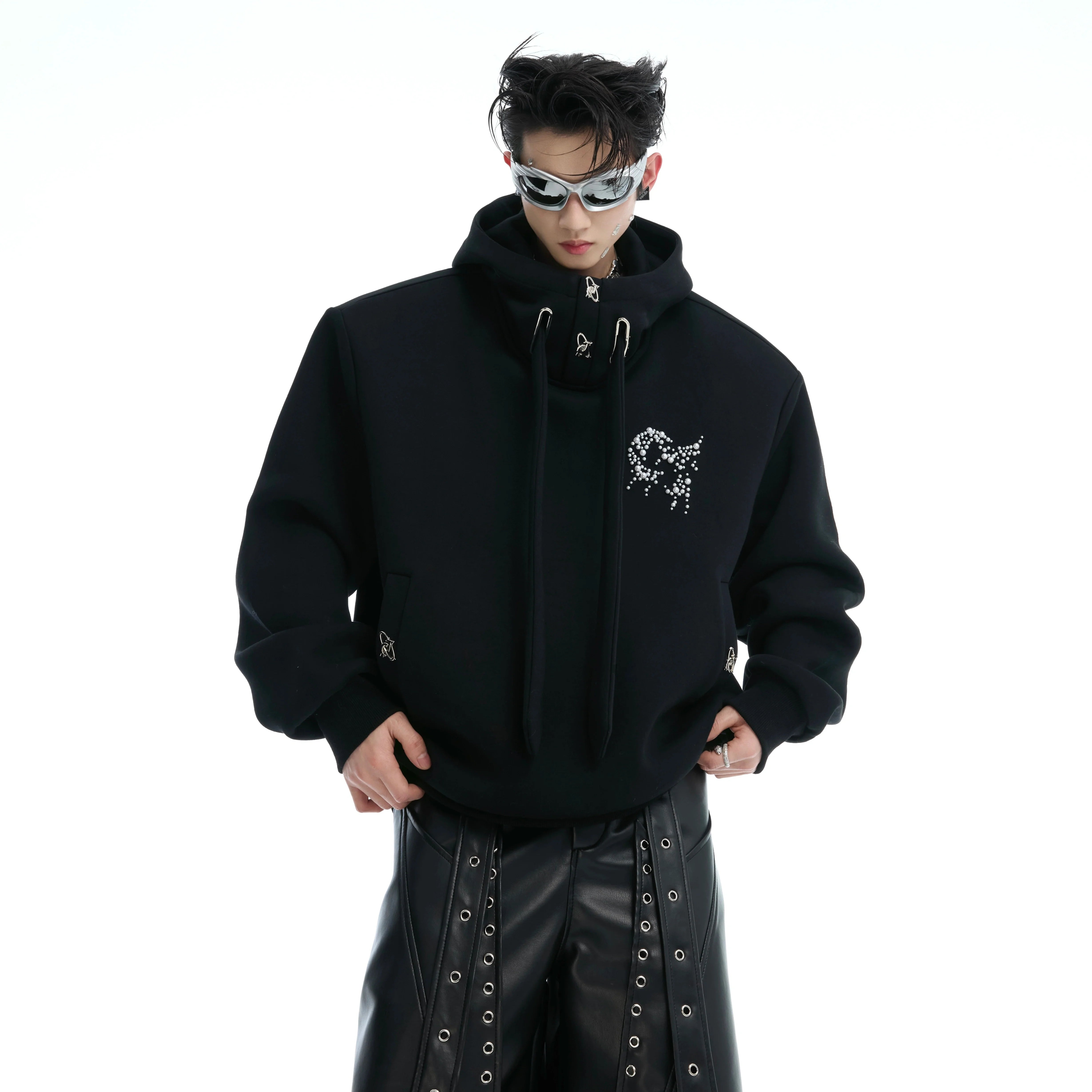 Oversized streetwear hoodie with pearl embellishments and padded shoulders for a bold fashion statement