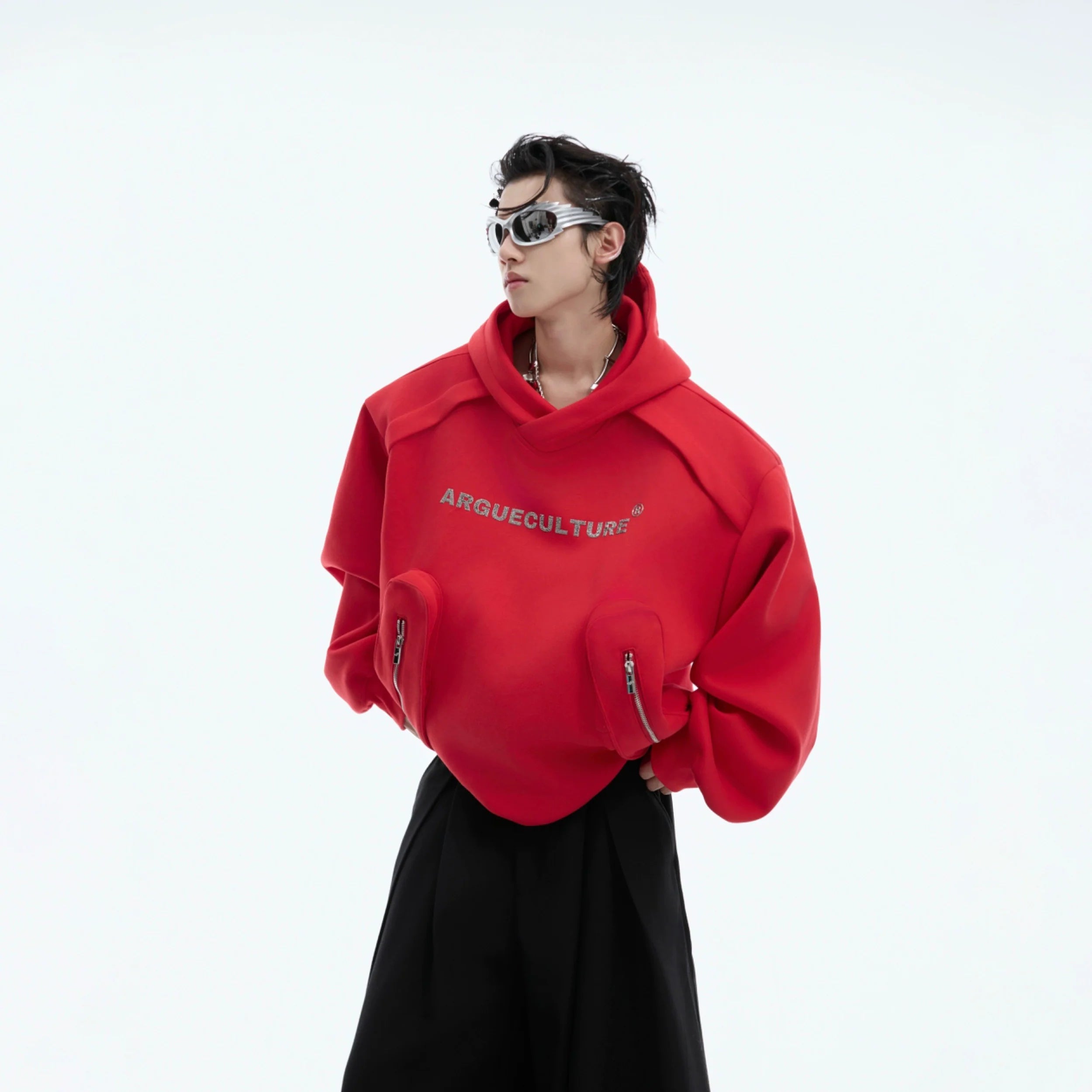 Front view of oversized hoodie with statement shoulder pads and metallic silver detailing, perfect for streetwear looks