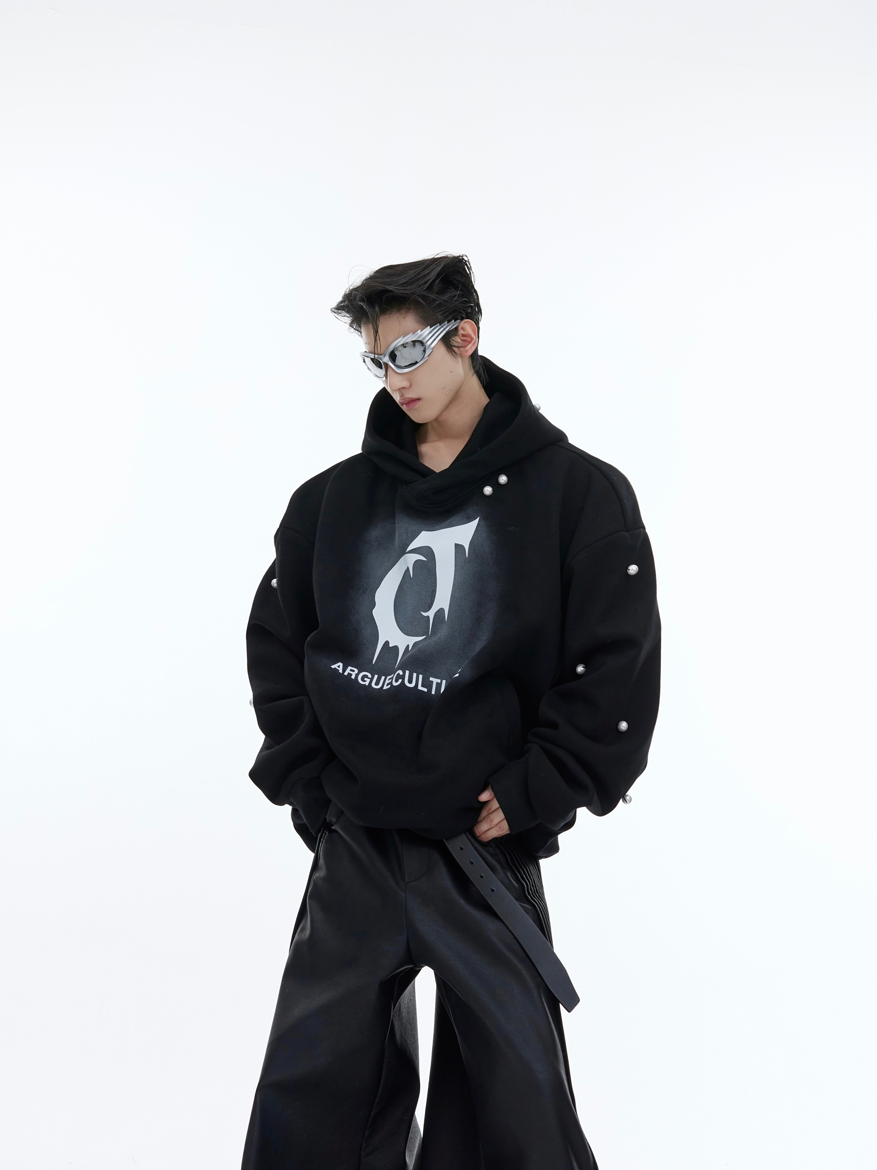 Side angle showing pearl embellishments on oversized graphic hoodie with cozy fleece interior