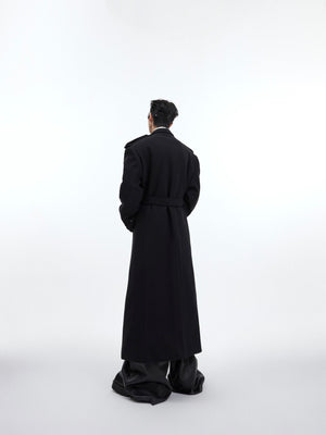 Back detail shot of heavyweight wool overcoat with unique deconstructed tailoring elements