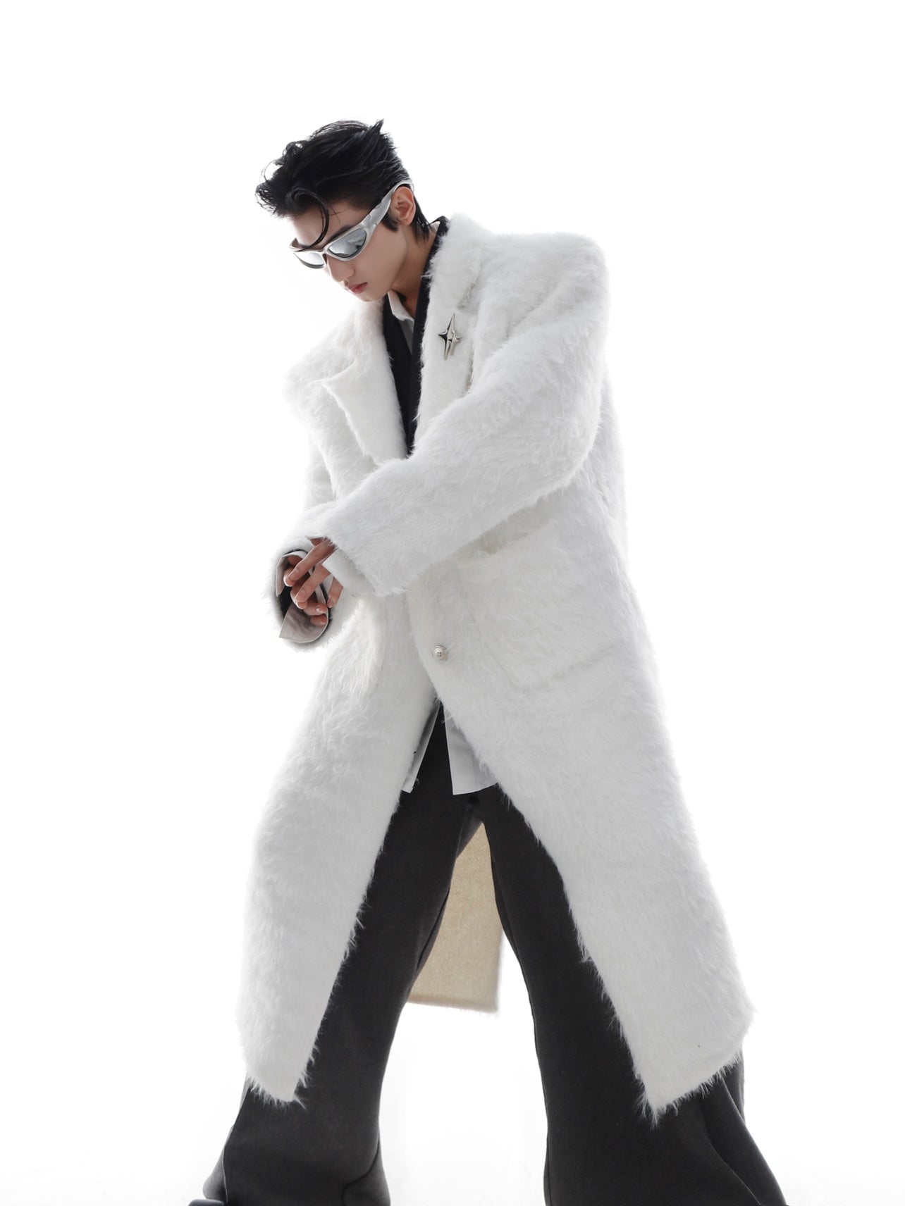 Model wearing oversized long trench coat showing premium faux fur texture and unisex streetwear design