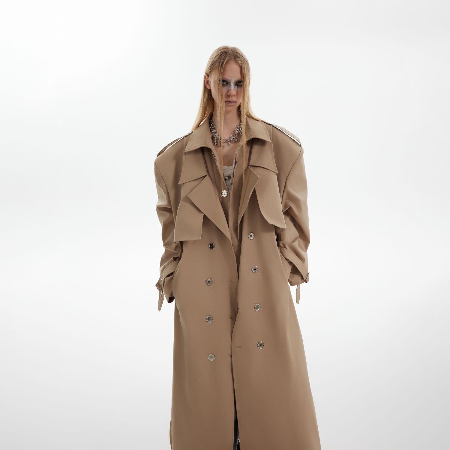 Side profile of the oversized long overcoat showing its elegant drape and premium heavyweight fabric texture