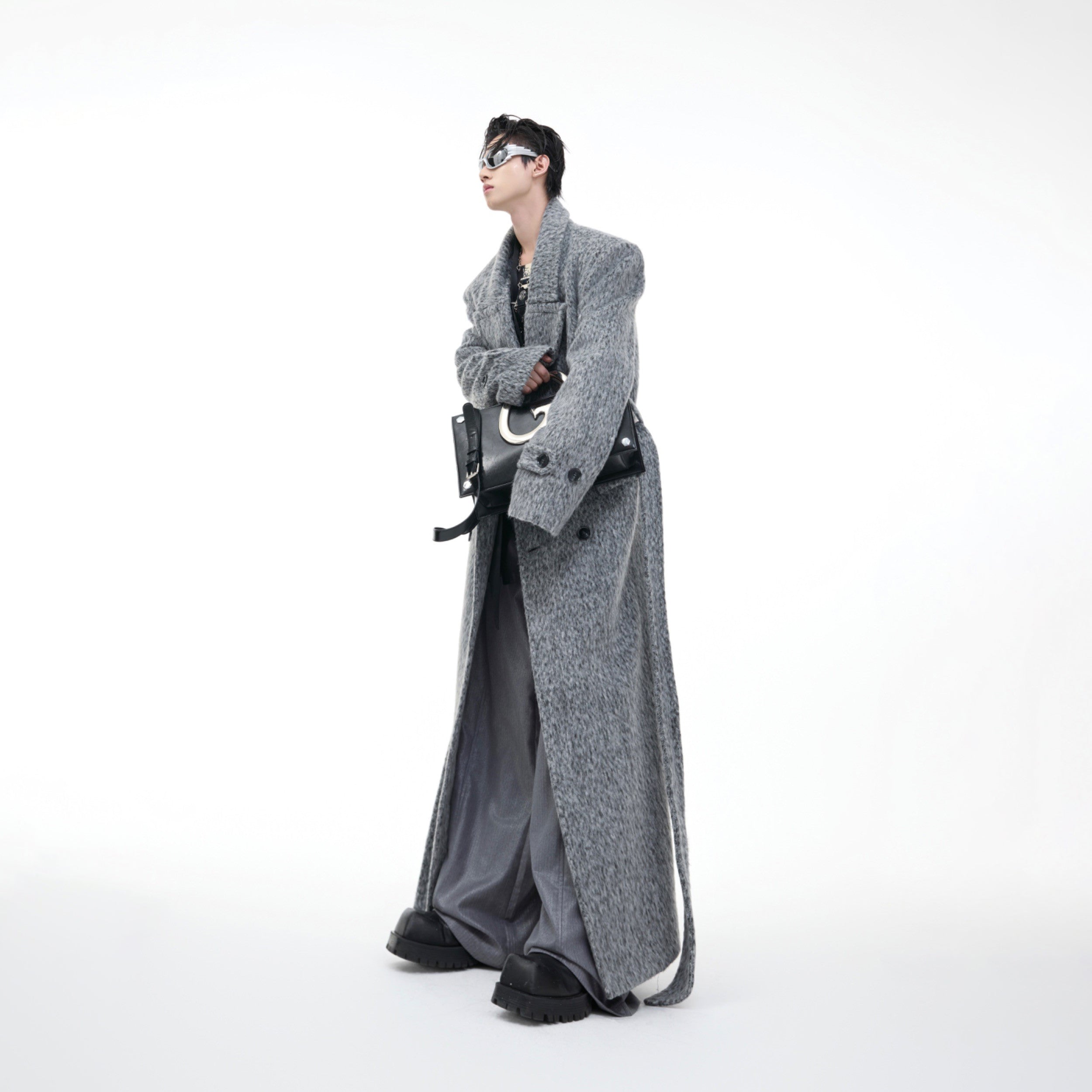 Oversized plush wool trench coat with wide shoulders and belted waist, perfect for street style fashion