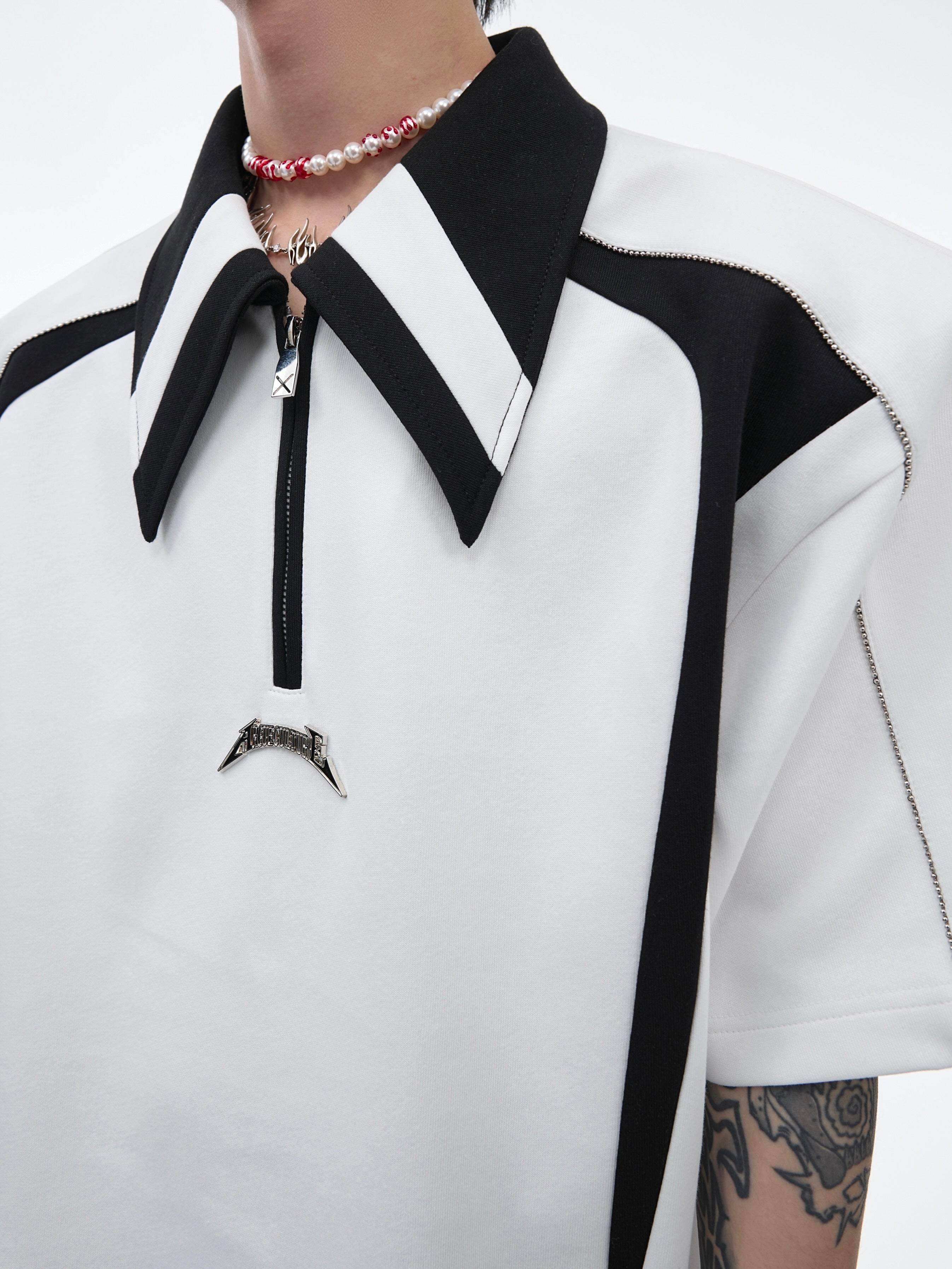 Side angle showing the premium fabric construction and deconstructed collar of this streetwear-inspired polo tee