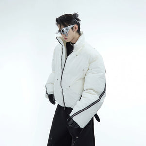 Front view of oversized deconstructed puffer jacket featuring unique multi-zipper streetwear design in urban style