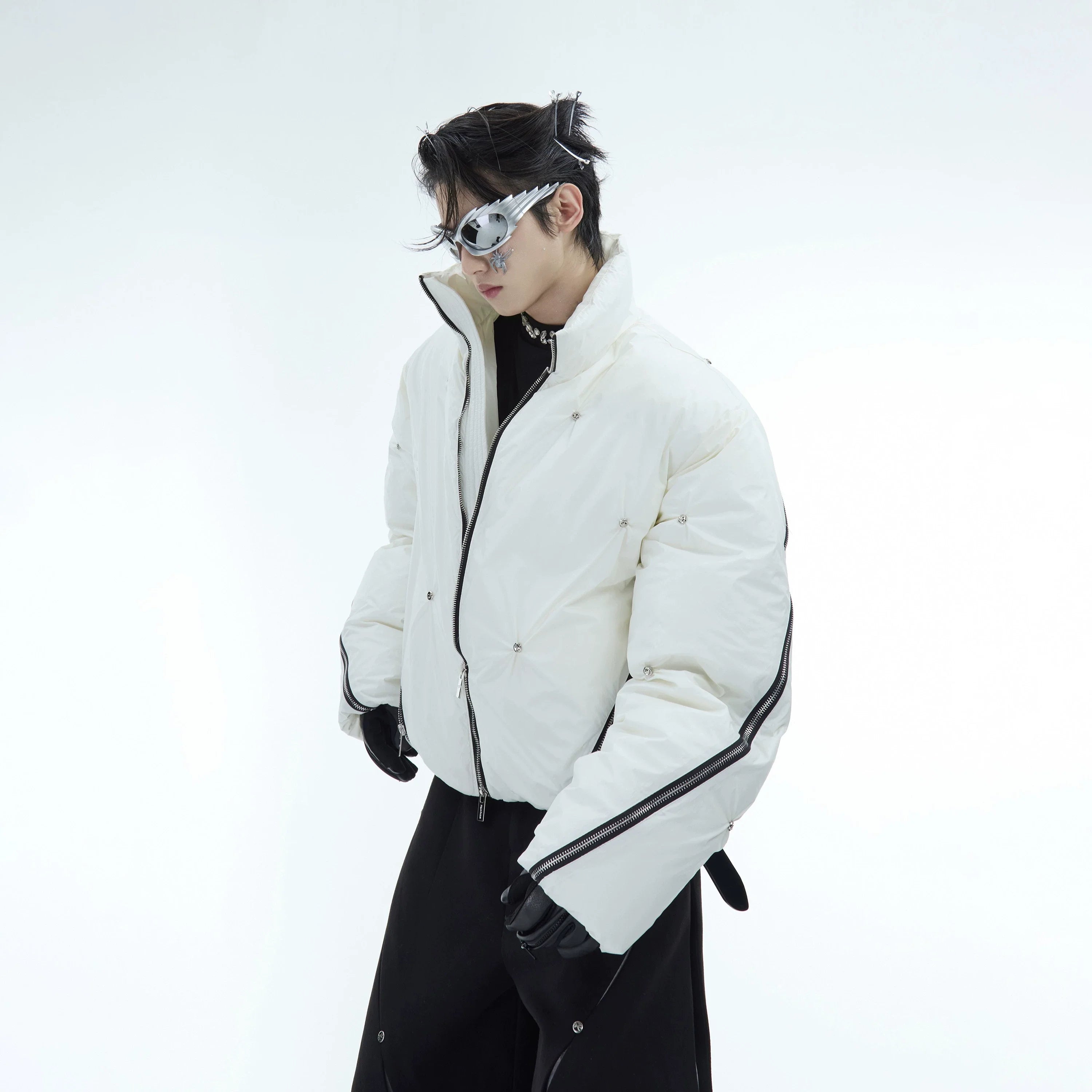 Front view of oversized deconstructed puffer jacket featuring unique multi-zipper streetwear design in urban style