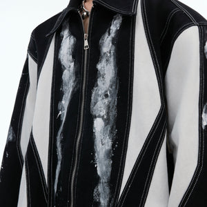 Front and back view of deconstructed oversized shirt-jacket showing unique color-block pattern and relaxed fit