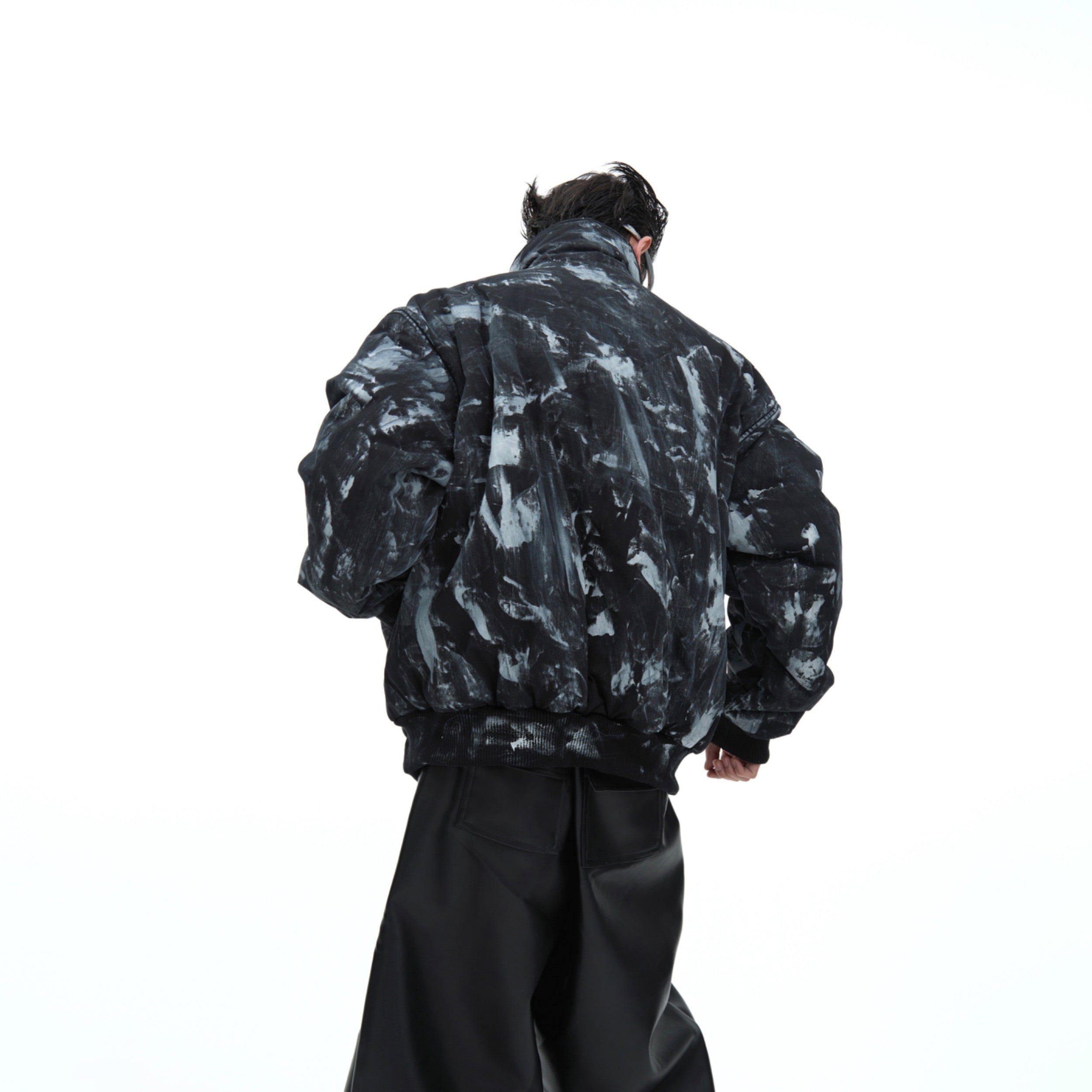 Close-up of hand-painted artistic details on heavyweight cotton winter coat with oversized streetwear silhouette