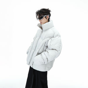 Front view of avant-garde deconstructed puffer jacket with cotton padding for winter street style
