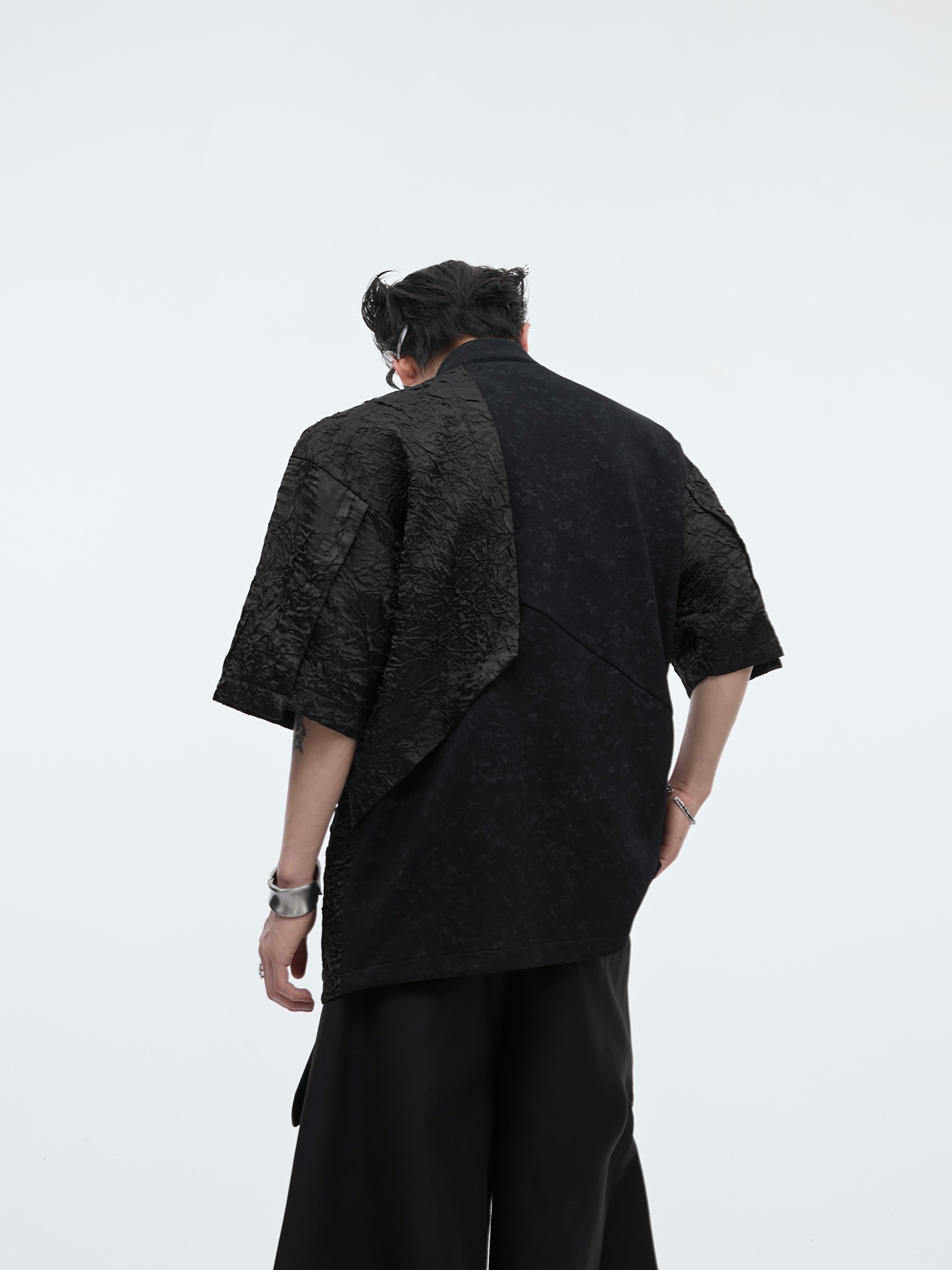 Side angle showcasing the deconstructed seams and contemporary Chinese-inspired streetwear aesthetic of this sleeveless top