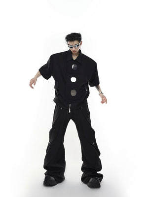 Side profile of deconstructed shoulder pad jacket showing its streetwear silhouette