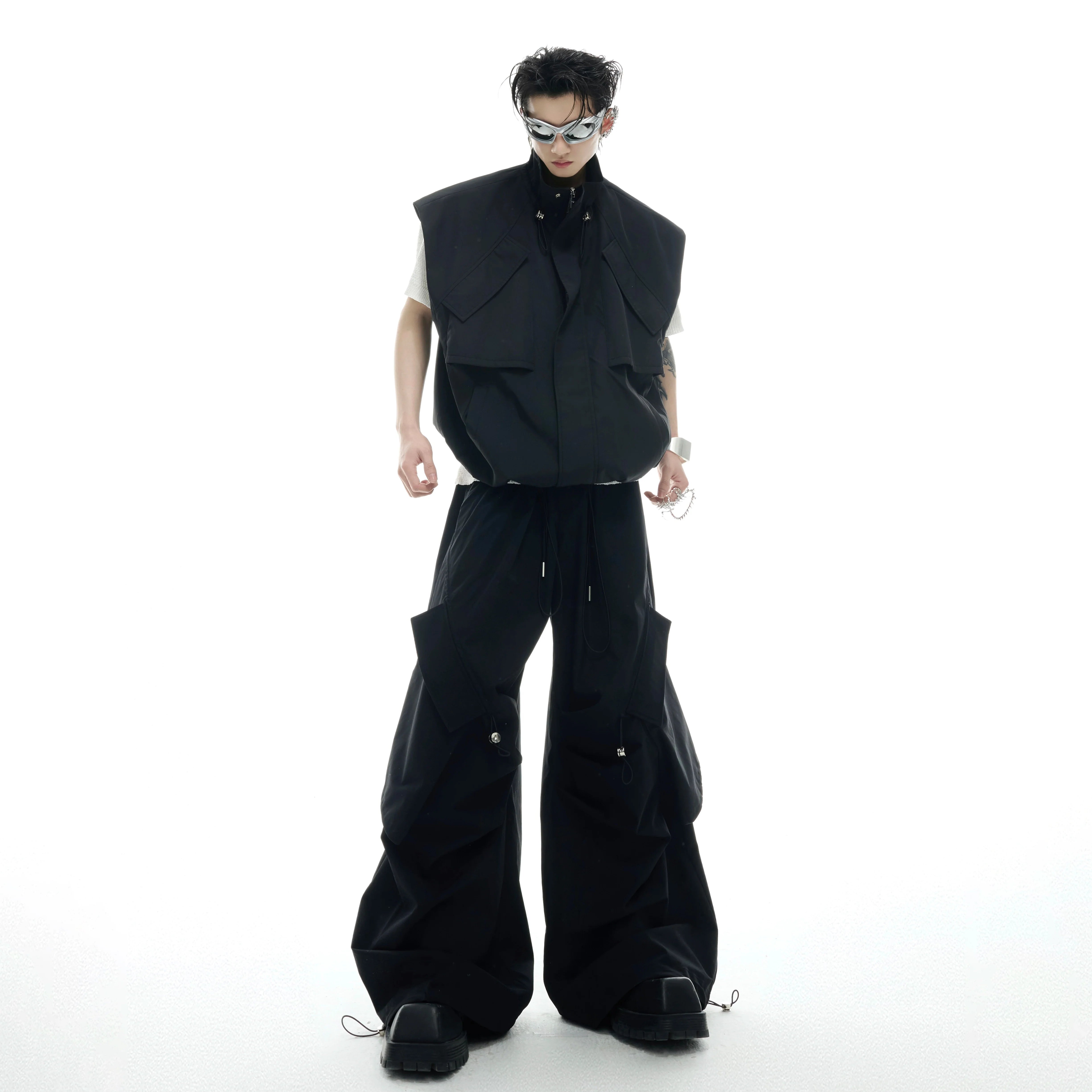 Oversized vest and pants set with adjustable drawstrings, showcasing the streetwear's irregular waist design and stand collar