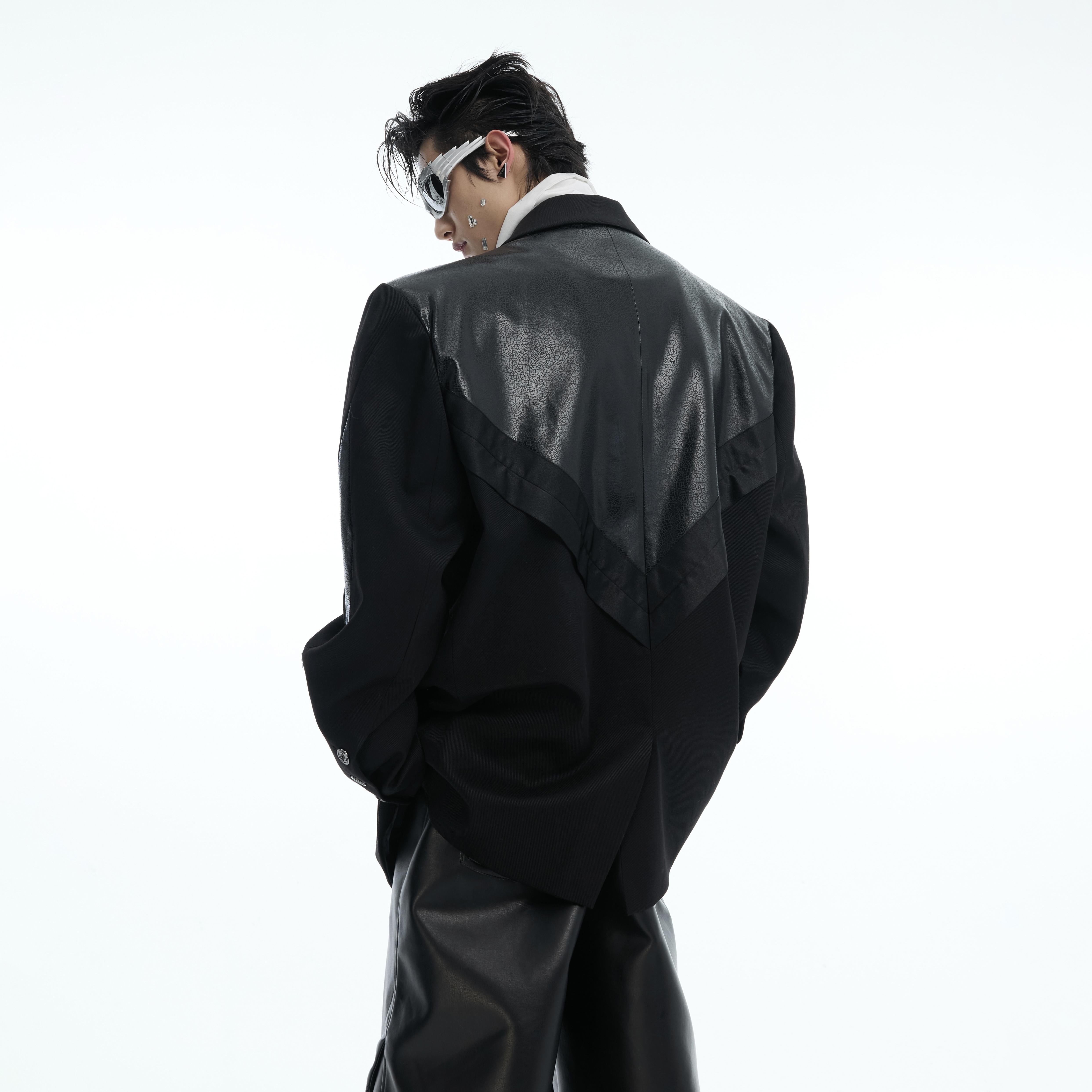 Vintage-inspired patchwork hoodie featuring three color panels and premium PU leather accents