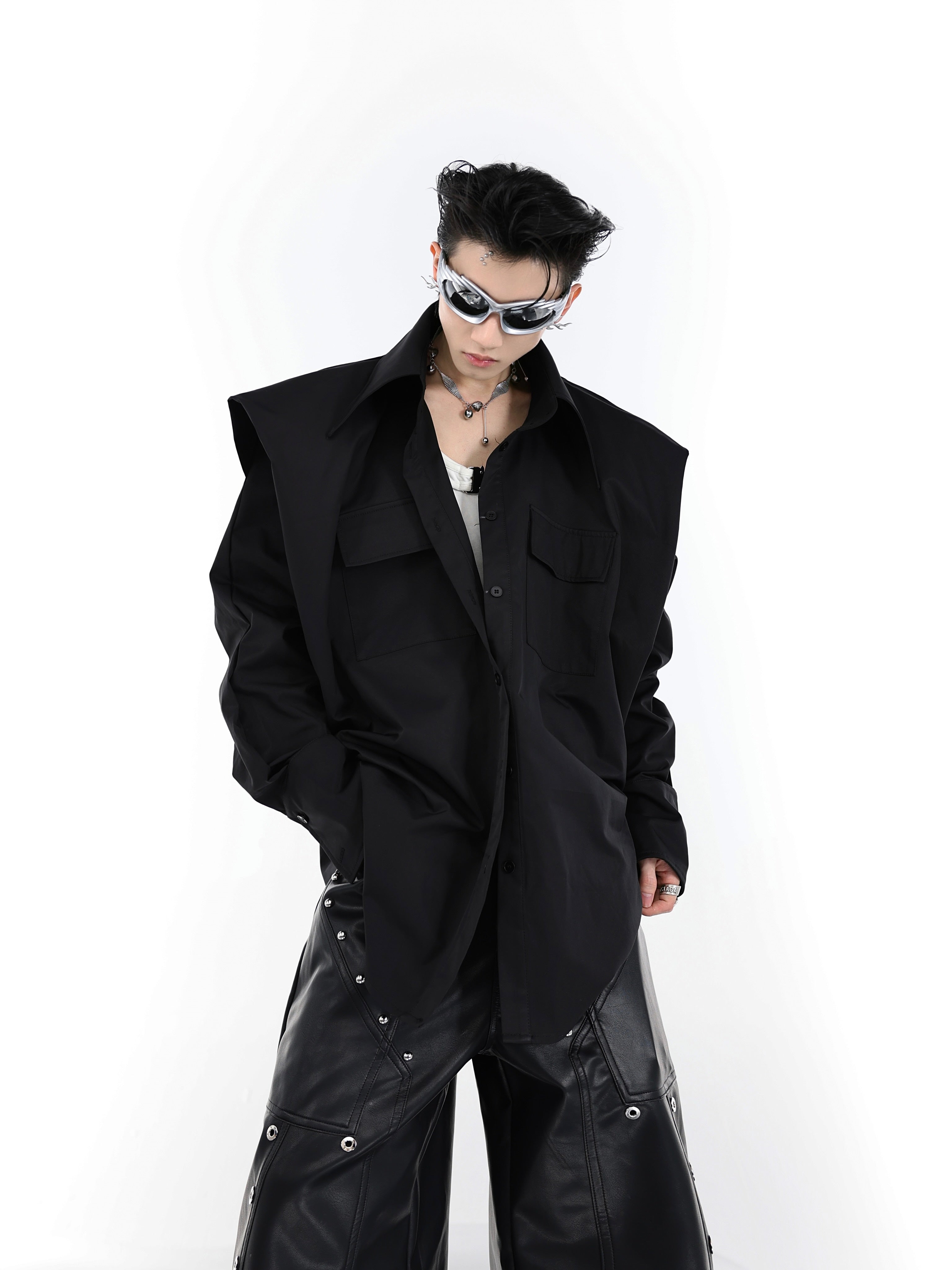 Deconstructed pleated oversized shirt with structured wide shoulders, a minimalist streetwear top for bold fashion statements