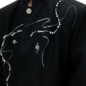 Detail shot showing ultra-breathable luxury fabric of snake print blazer with silky-smooth texture