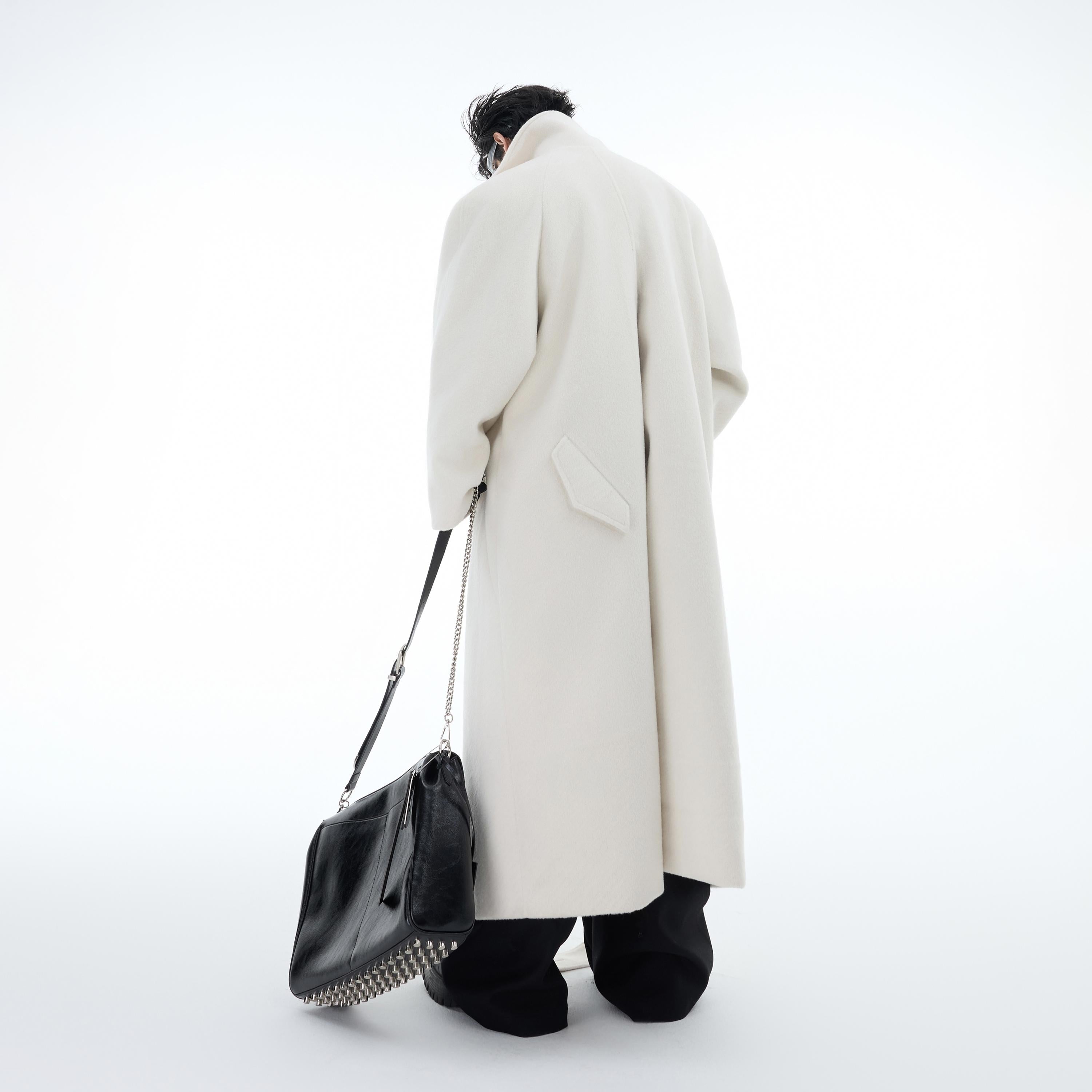 Front view of premium heavyweight wool overcoat showing exquisite craftsmanship and smooth texture